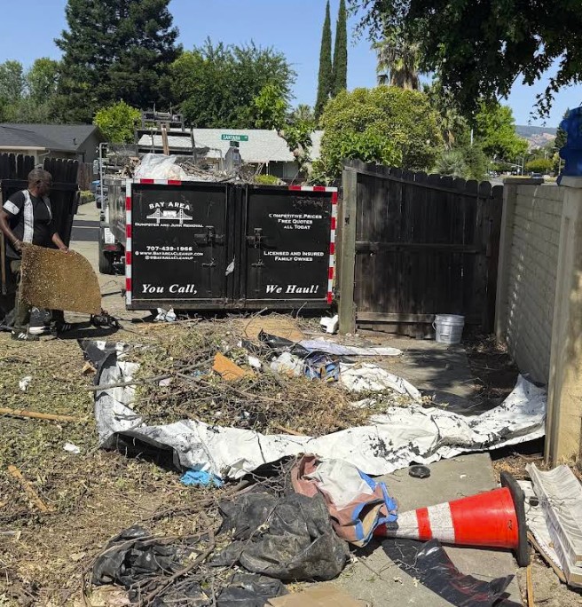 Crew member clearing debris at a cleanup job